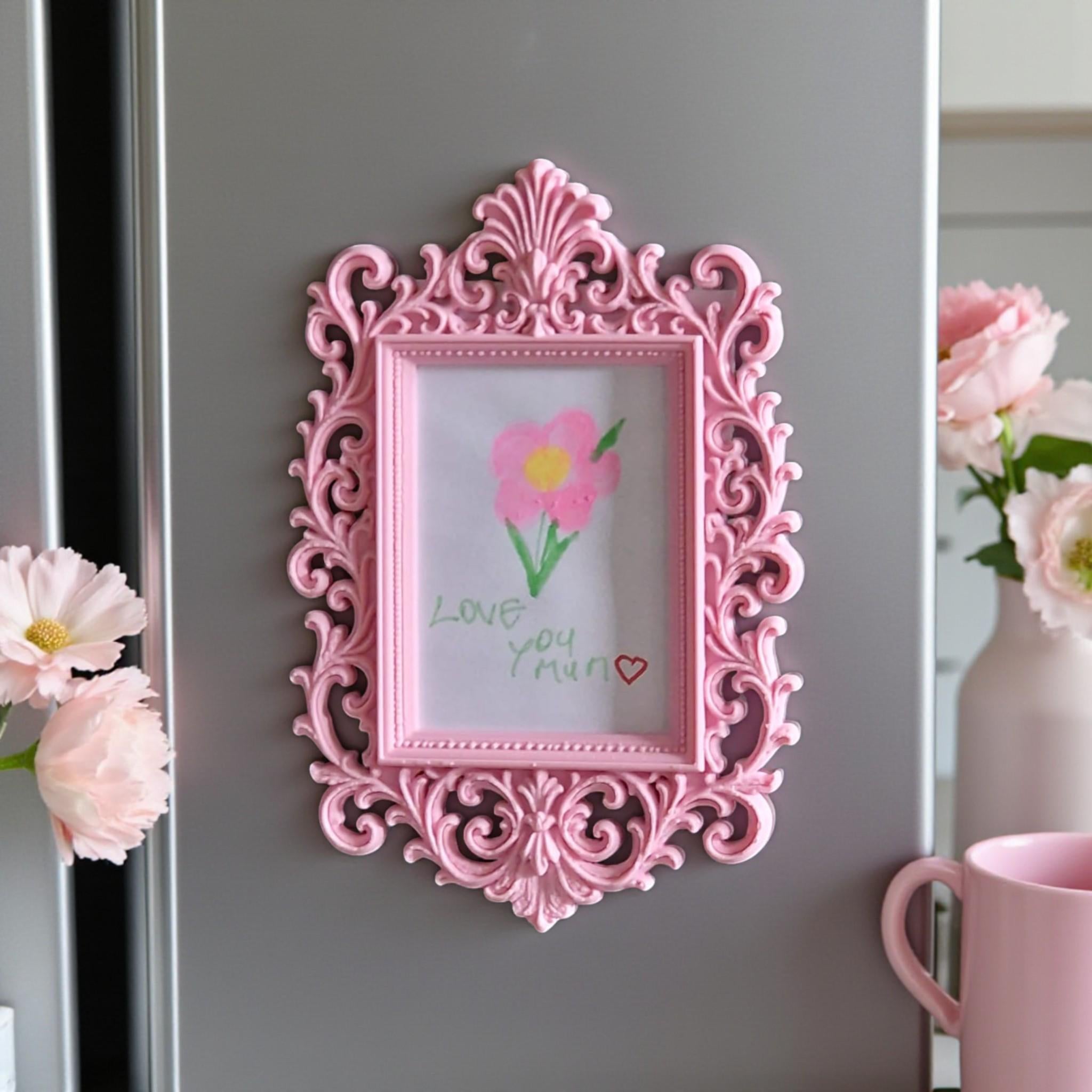 Display your child’s drawings or favourite photos with this pink ornate magnetic fridge frame – a decorative refrigerator photo magnet frame perfect for kids artwork and family memories.