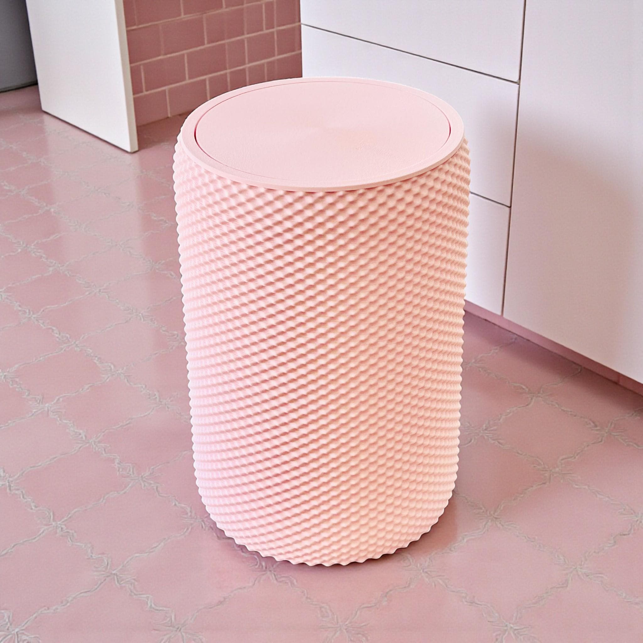 Pink textured stool on a pink tiled floor