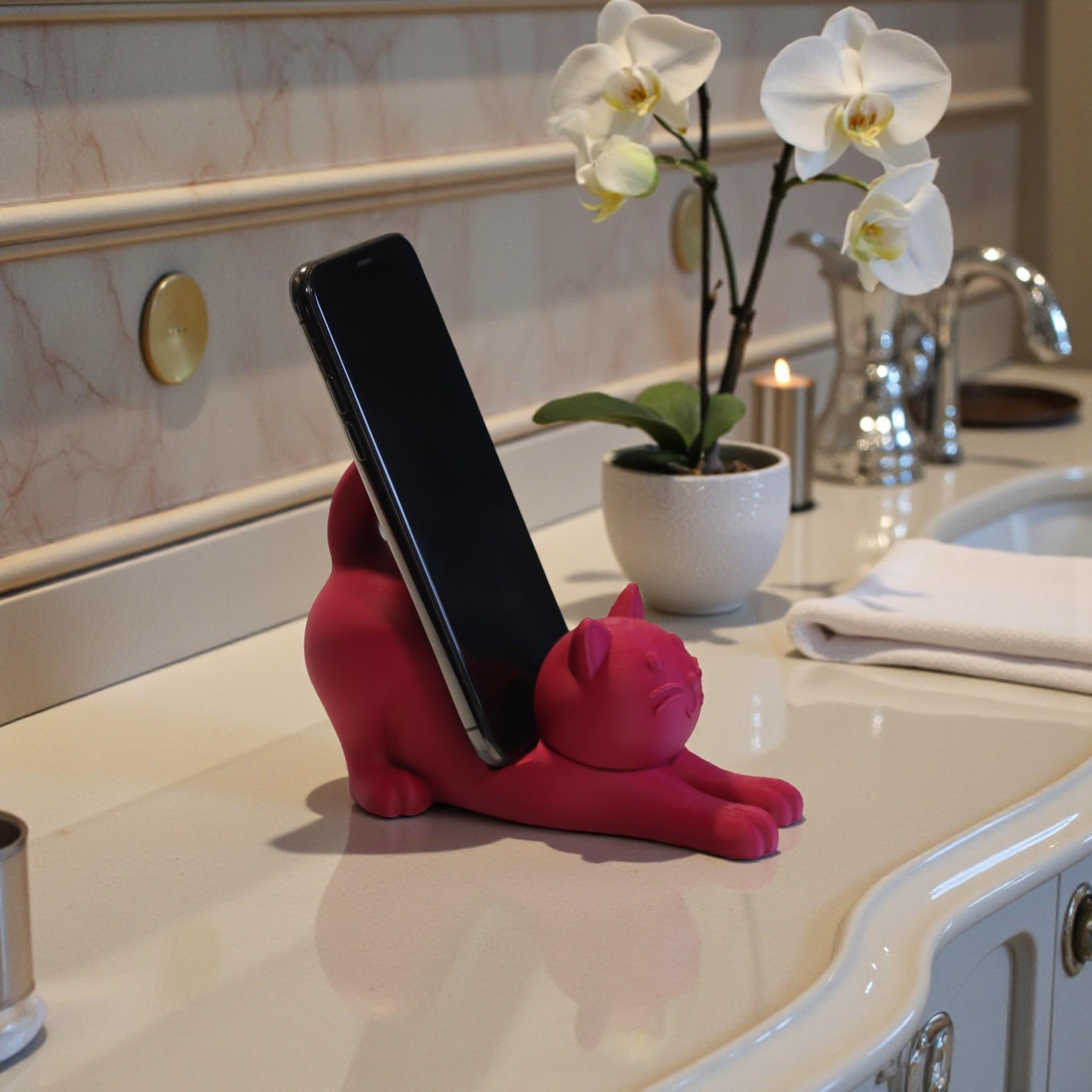 This cute cat phone stand holder is perfect for keeping your smartphone upright on your desk while adding a fun decoration for cat lovers.