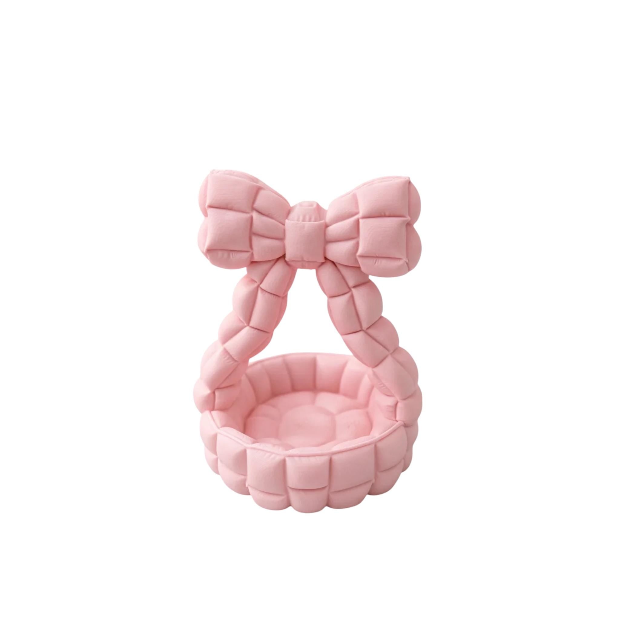 Quilted bow catchall basket used as jewelry dish on vanity, cute aesthetic decor
Pink bow jewelry holder with padded handle, decorative trinket dish for nightstand
Bow shaped quilted basket for rings and earrings, feminine desk and vanity organizer
Aesthetic bow catchall basket with quilted texture, stylish storage for small essentials