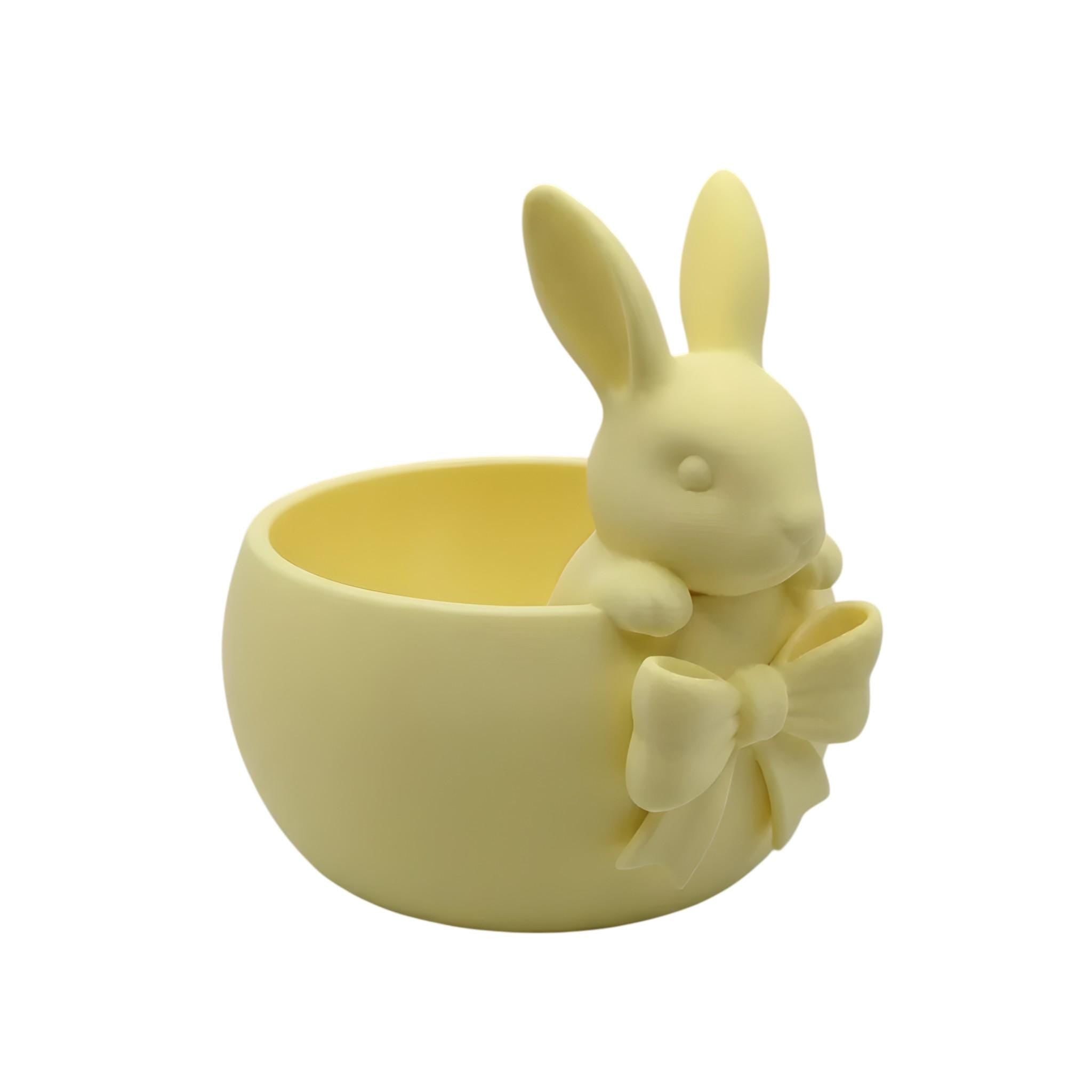 Pink Easter bowl with a bunny and bow detail, used as a cute candy dish for Easter eggs, chocolates, and spring table decor.