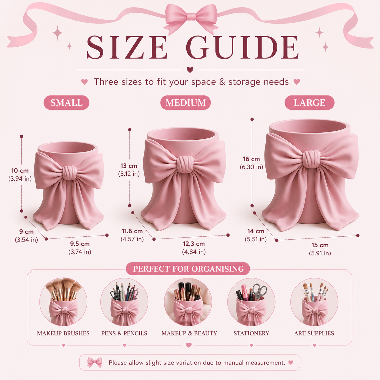May include: A pink makeup brush holder with a bow design, holding several makeup brushes. Other pink makeup accessories are visible in the background, including a mirror and compacts. The scene is set on a white surface.