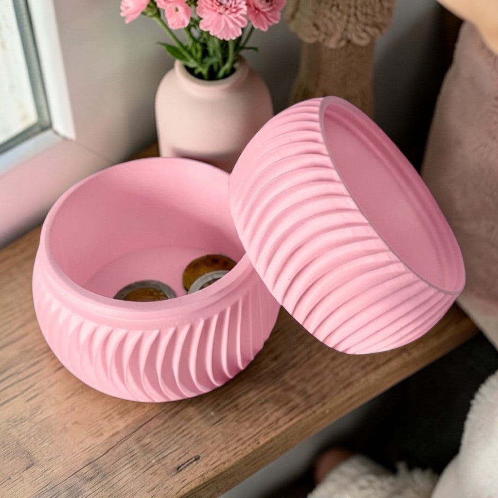 A modern 3D-printed coin bank with a sleek, openable design, available in two sizes. Perfect for storing coins and cash securely while adding a stylish touch to any home or office. Ideal for kids, adults, and as a unique gift for savers.