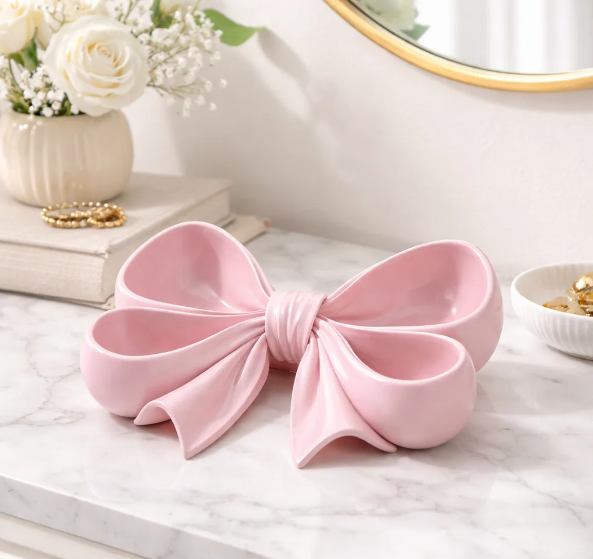 pink bow tray coquette decor vanity organiser
feminine jewelry dish bow shape pink tray
cute pink tray for rings and earrings storage
girly vanity setup with bow tray organizer