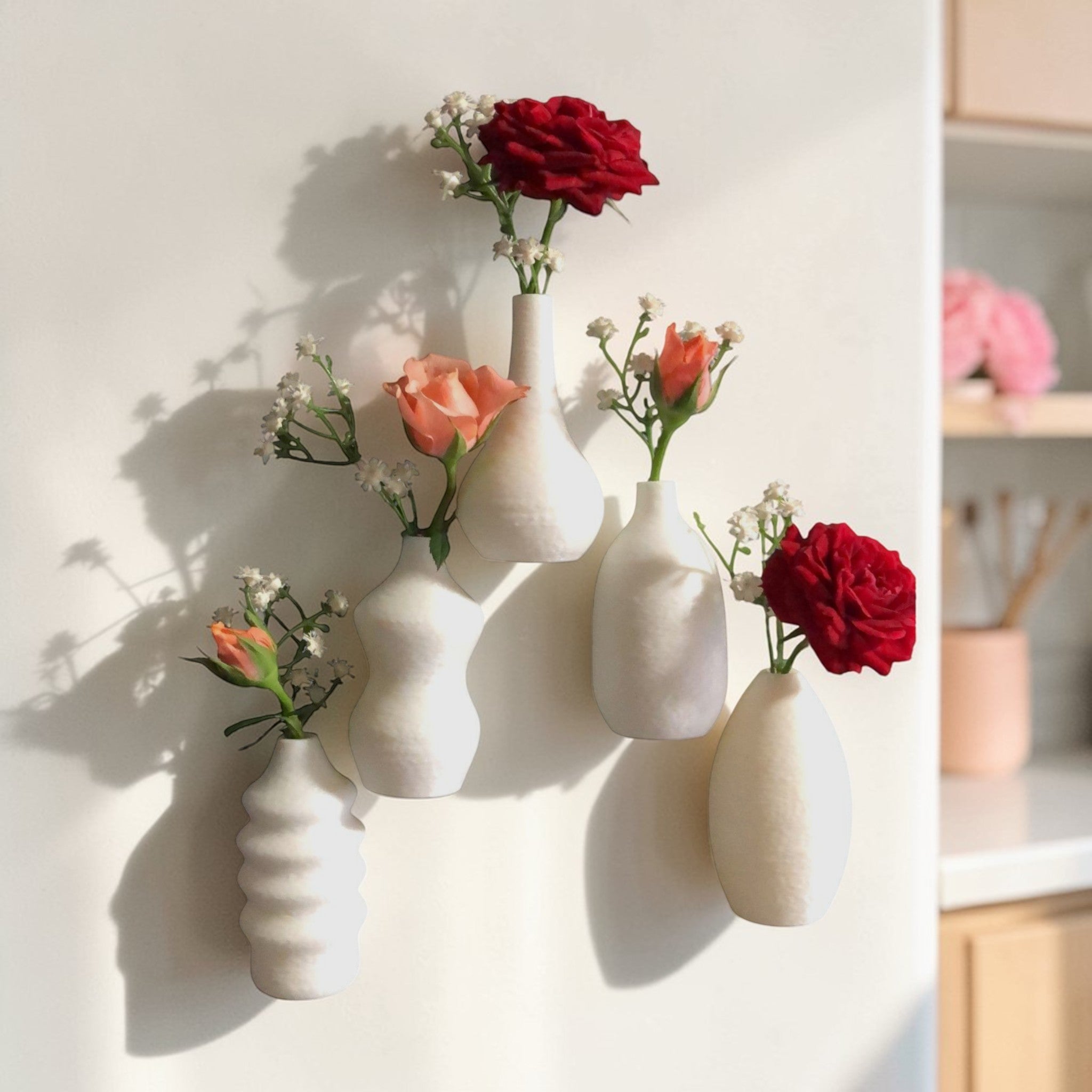 Child handing a tiny flower to their mom, with a magnetic mini vase on the fridge in the background—capturing a heartwarming everyday moment