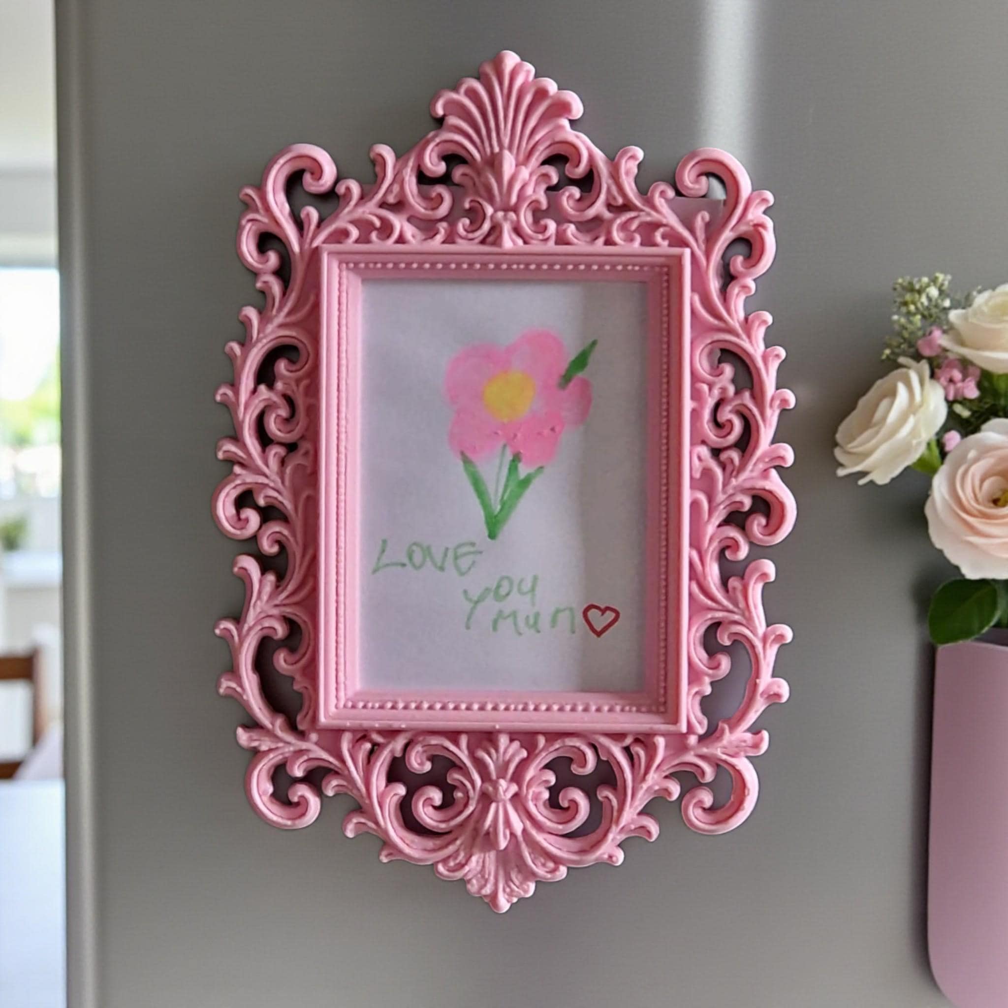 Display your child’s drawings or favourite photos with this pink ornate magnetic fridge frame – a decorative refrigerator photo magnet frame perfect for kids artwork and family memories.