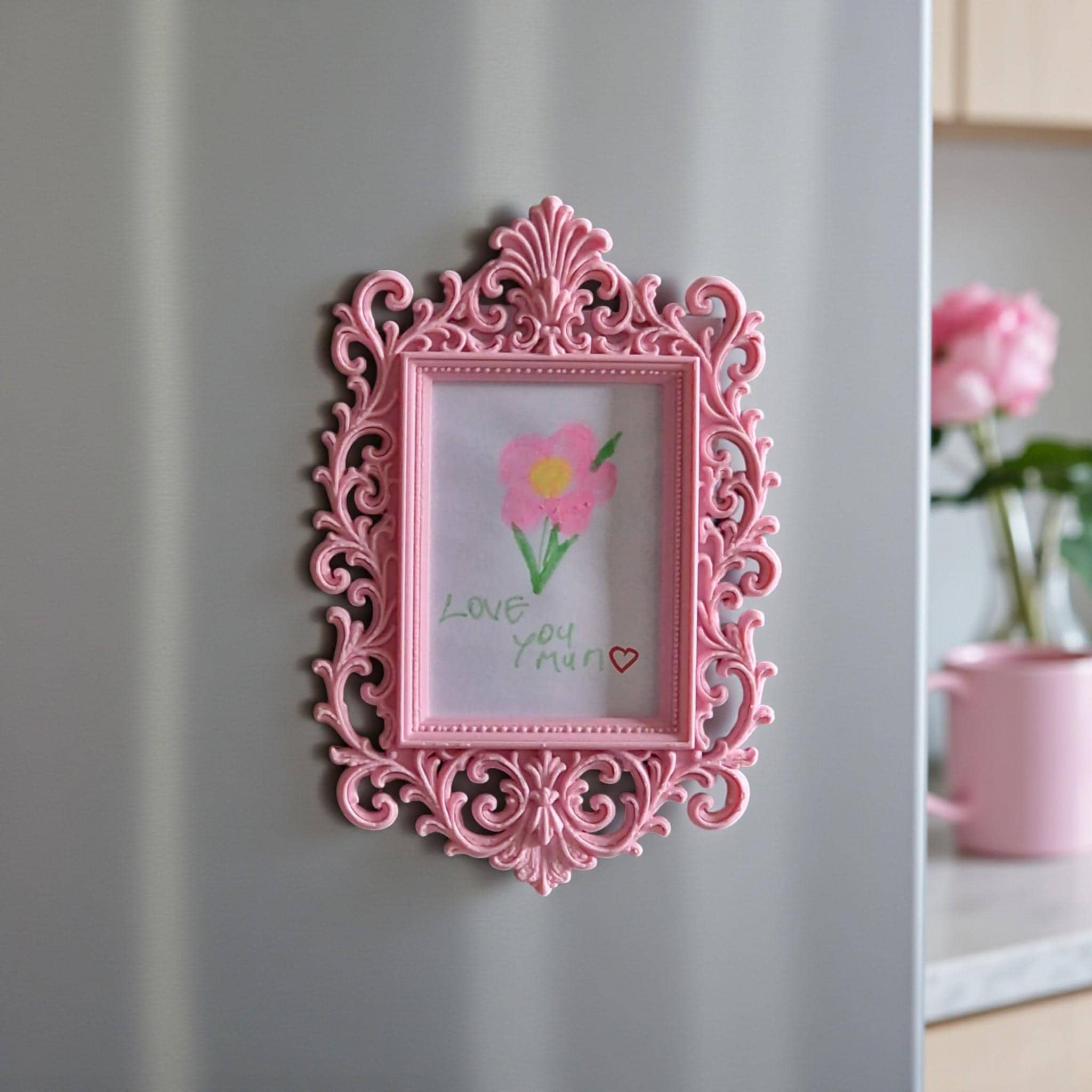 Display your child’s drawings or favourite photos with this pink ornate magnetic fridge frame – a decorative refrigerator photo magnet frame perfect for kids artwork and family memories.