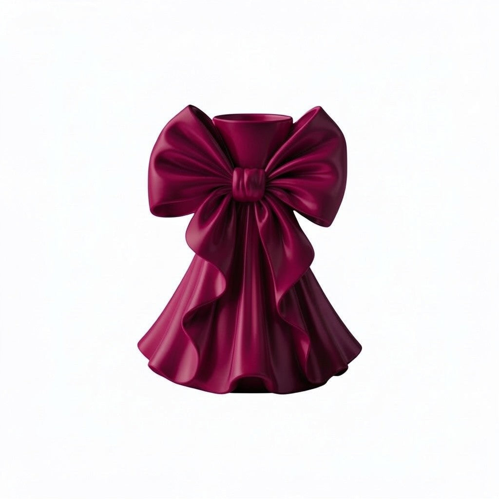 Coquette bow vase with pleated fabric-style design in soft pink on a vanity table
Romantic bow flower vase styled with roses and feminine home decor
Sculptural bow vase with matte finish for bridal and coquette interiors
Feminine decorative vase with gift-inspired silhouette and elegant bow
 Soft aesthetic flower vase designed for romantic and luxury spaces