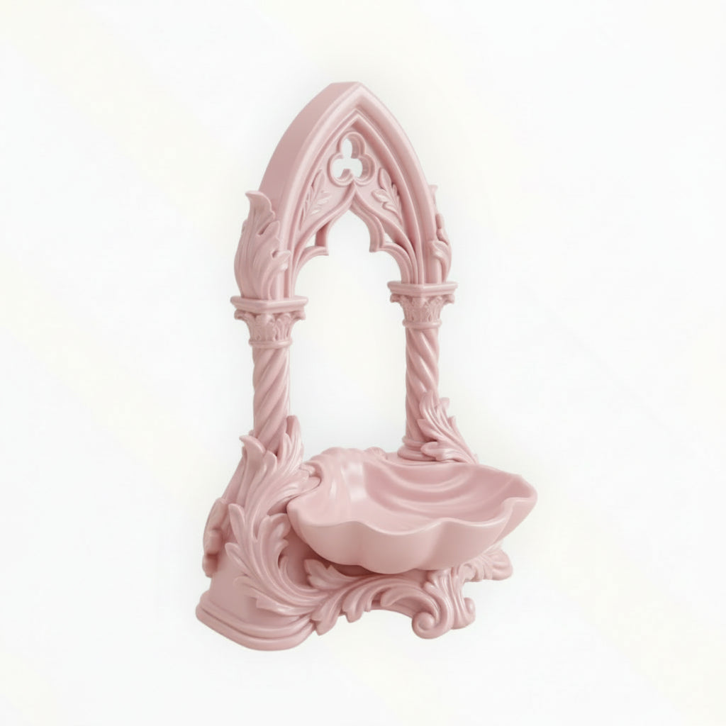 May include: A pink jewellery organiser with an arched design, displaying gold necklaces and earrings. A small dish at the base holds extra jewellery. The organiser sits on a dressing table with a mirror, perfume, and a vase of pink flowers.