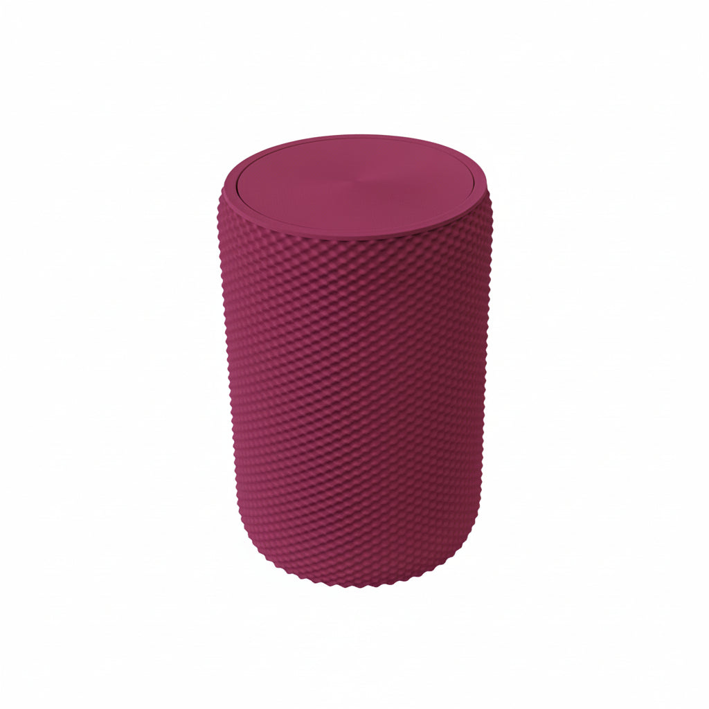 Pink vanity bin with textured design placed on wooden vanity table