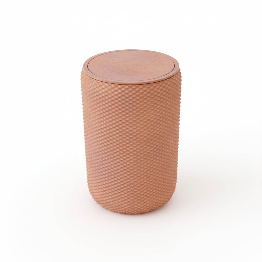 Pink vanity bin with textured design placed on wooden vanity table