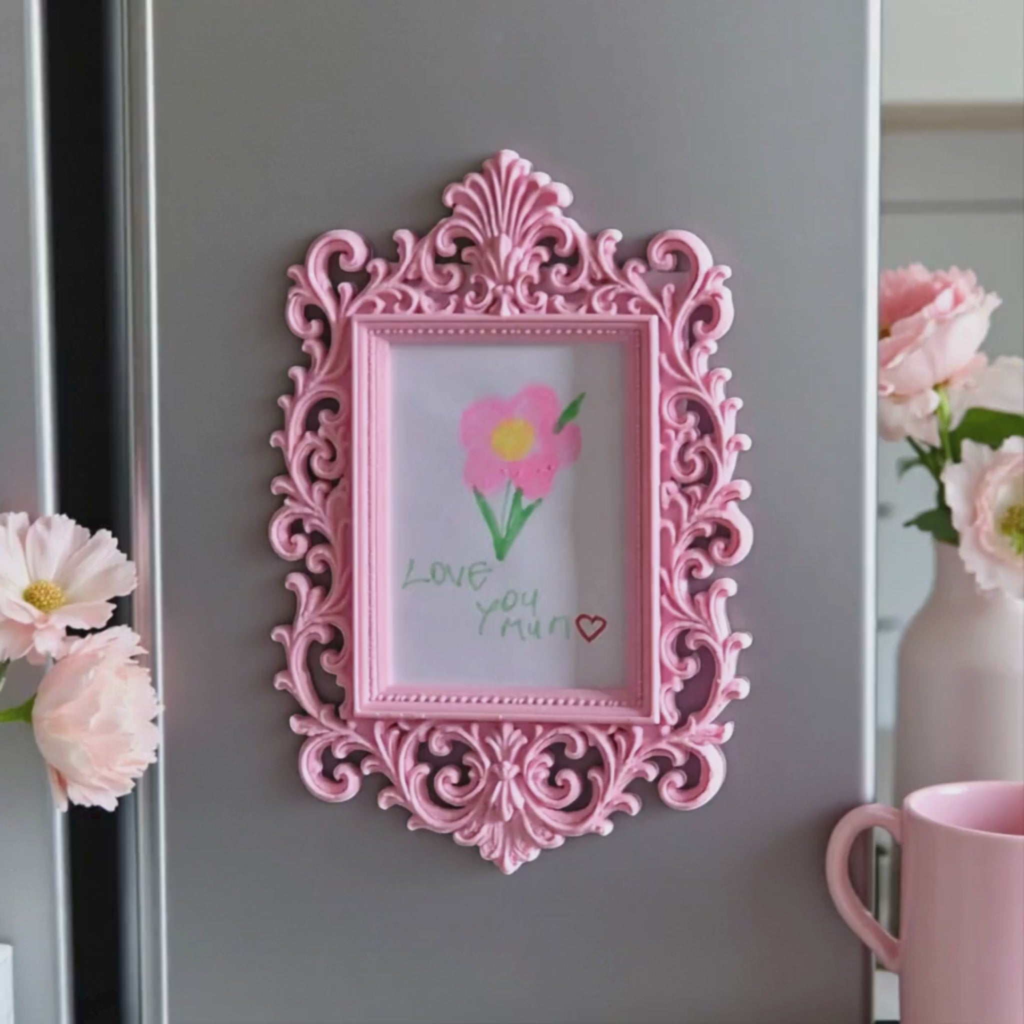 Display your child’s drawings or favourite photos with this pink ornate magnetic fridge frame – a decorative refrigerator photo magnet frame perfect for kids artwork and family memories.