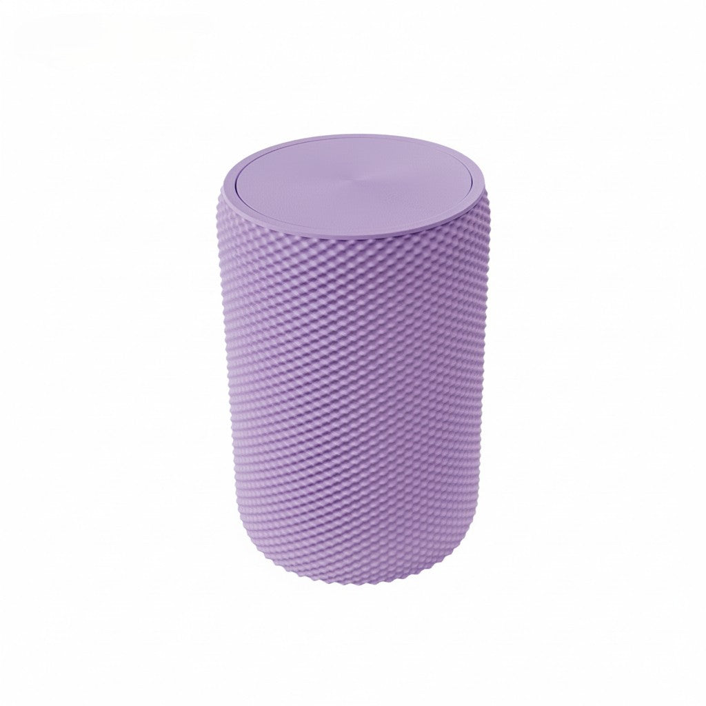 Pink vanity bin with textured design placed on wooden vanity table