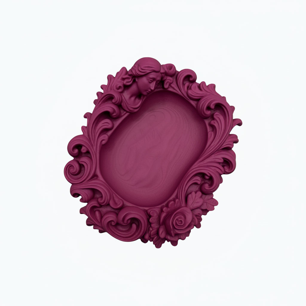Pink rococo-style woman and rose catchall tray used as a jewelry dish, holding a gold ring, pearl earrings, and a necklace on a vanity surface.