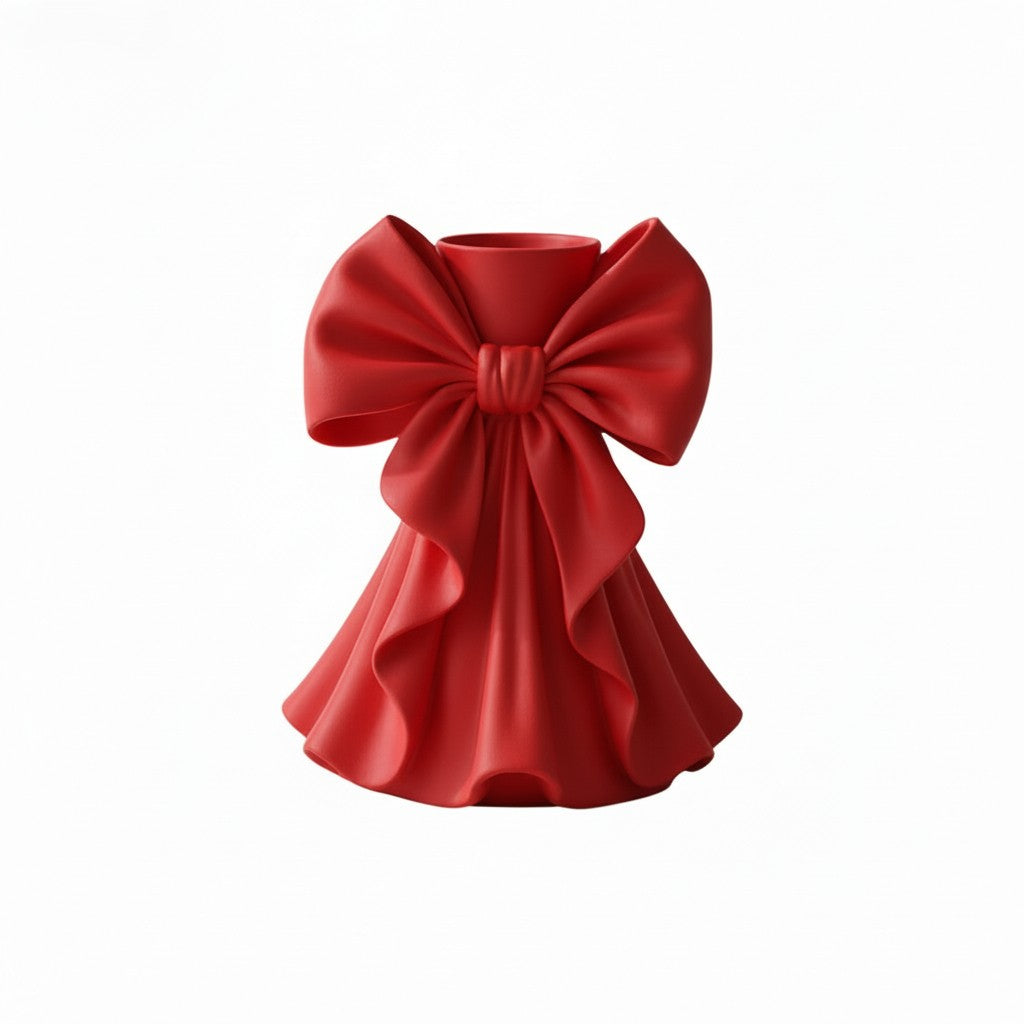 Coquette bow vase with pleated fabric-style design in soft pink on a vanity table
Romantic bow flower vase styled with roses and feminine home decor
Sculptural bow vase with matte finish for bridal and coquette interiors
Feminine decorative vase with gift-inspired silhouette and elegant bow
 Soft aesthetic flower vase designed for romantic and luxury spaces