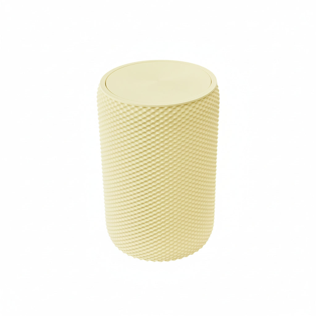 Pink vanity bin with textured design placed on wooden vanity table